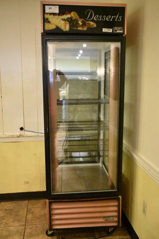 True G4SM-23 Metal Commercial Single Door Reach In Cooler Merchandiser w/ Poly Coated Racks on Commercial Casters. 115 Volts, 1 Phase. This Unit Was In Working Condition When the Restaurant Closed. (main dining room)