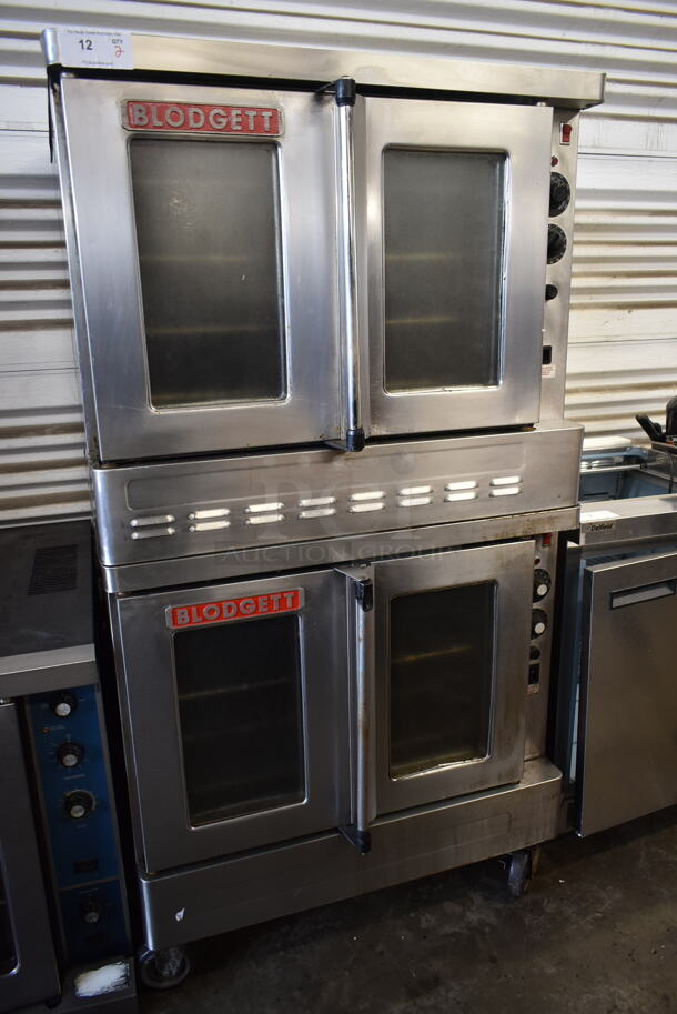 2 Blodgett SHO-100-G Stainless Steel Commercial Natural Gas Powered Full Size Convection Oven w/ View Through Doors, Metal Oven Racks and Thermostatic Controls on Commercial Casters. 2 Times Your Bid!