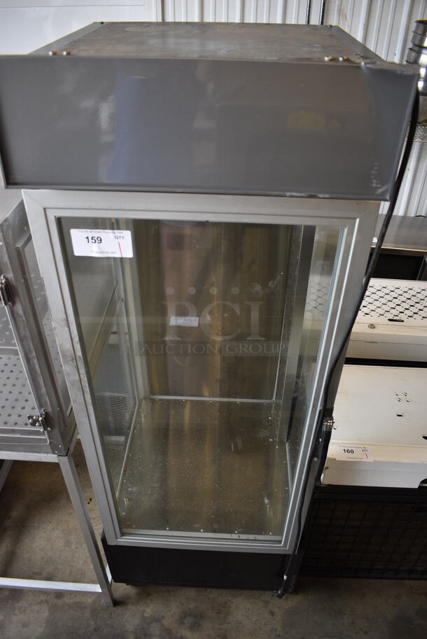 Hatco Model PFST-1X Metal Commercial Heated Holding Merchandiser Display Case on Commercial Casters. 120 Volts, 1 Phase. 24x25x70. Tested and Powers On But Does Not Get Warm