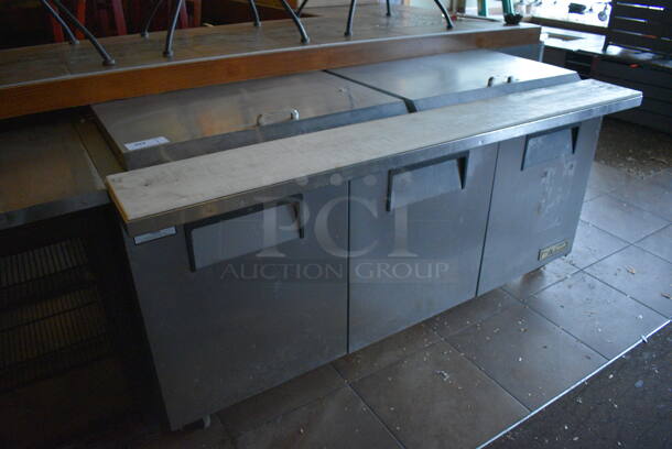 2011 True TSSU-72-30M-B-ST Stainless Steel Commercial Pizza Prep Table on Commercial Casters. BUYER MUST REMOVE. 115 Volts, 1 Phase. 72x34x38. Item Was in Working Condition on Last Day of Business. (Susquehanna Ale House)