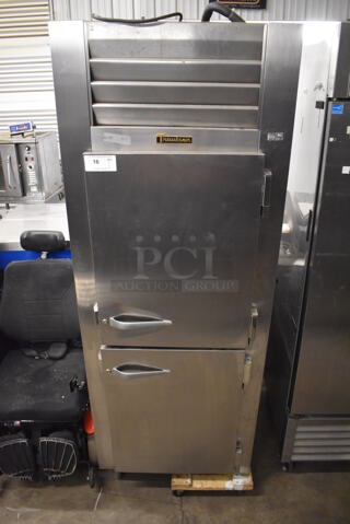 Traulsen AHT132WPUT-HHS Stainless Steel Commercial Two Half Size Door Reach In Pass Through Cooler. Missing 2 Legs. 115 Volts, 1 Phase. 30x35x83. Tested and Powers On But Does Not Get Cold