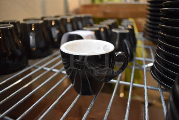 12 Black and White Ceramic Mugs. 3.25x2.5x2.5. 12 Times Your Bid!