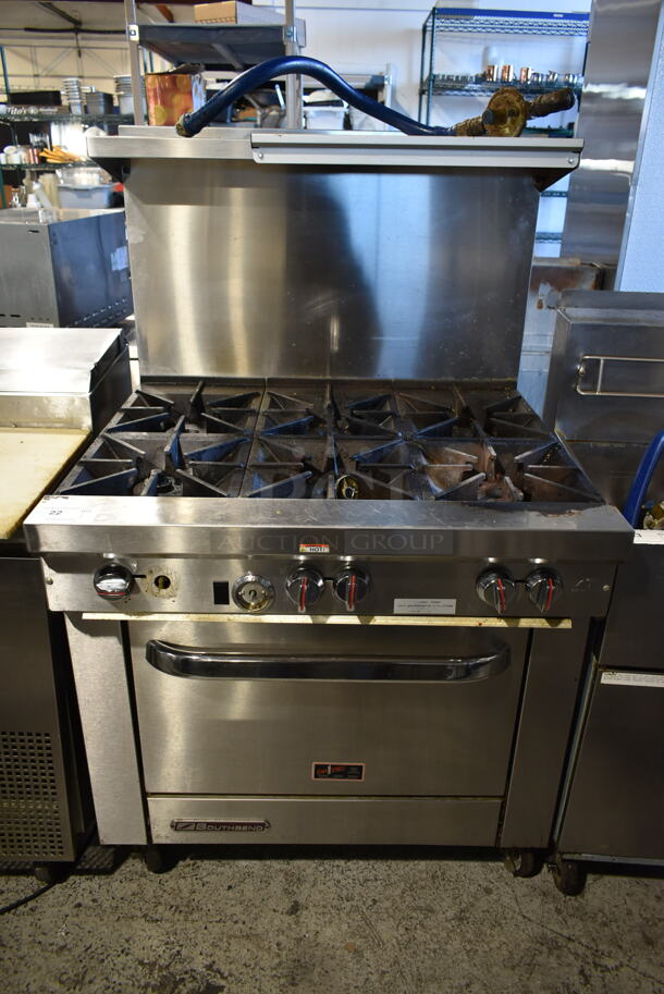 2016 Southbend S36D Stainless Steel Commercial Natural Gas Powered 6 Burner Range w/ Oven, Over Shelf and Back Splash on Commercial Casters. 