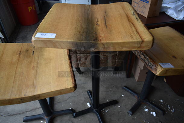 Wooden Bar Height Table w/ Live Edge on Black Metal Table Base. 