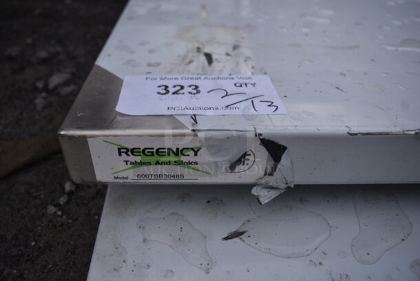 BRAND NEW SCRATCH AND DENT! Regency 600TSB3048S 30" x 48" 16-Gauge Stainless Steel Commercial Work Table with 4" Backsplash and Undershelf - Image 5 of 6