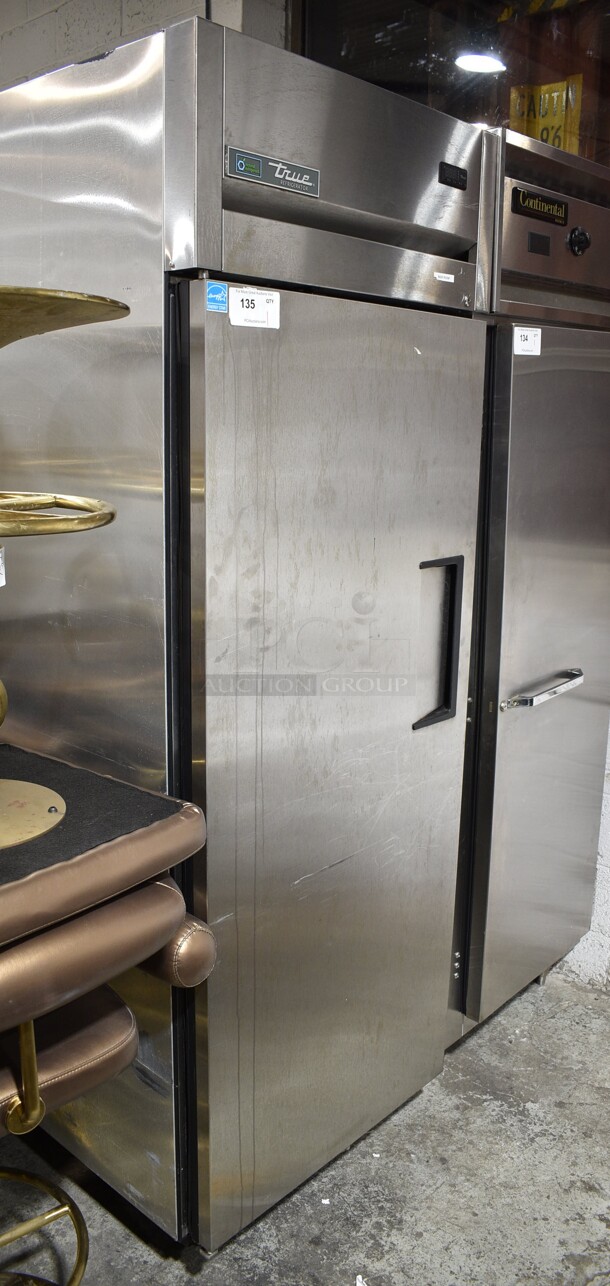LATE MODEL! True ENERGY STAR Stainless Steel Commercial Single Door Reach In Cooler on Commercial Casters. See Pictures for Dent on Side. 115 Volts, 1 Phase. Tested and Working! - Image 1 of 4