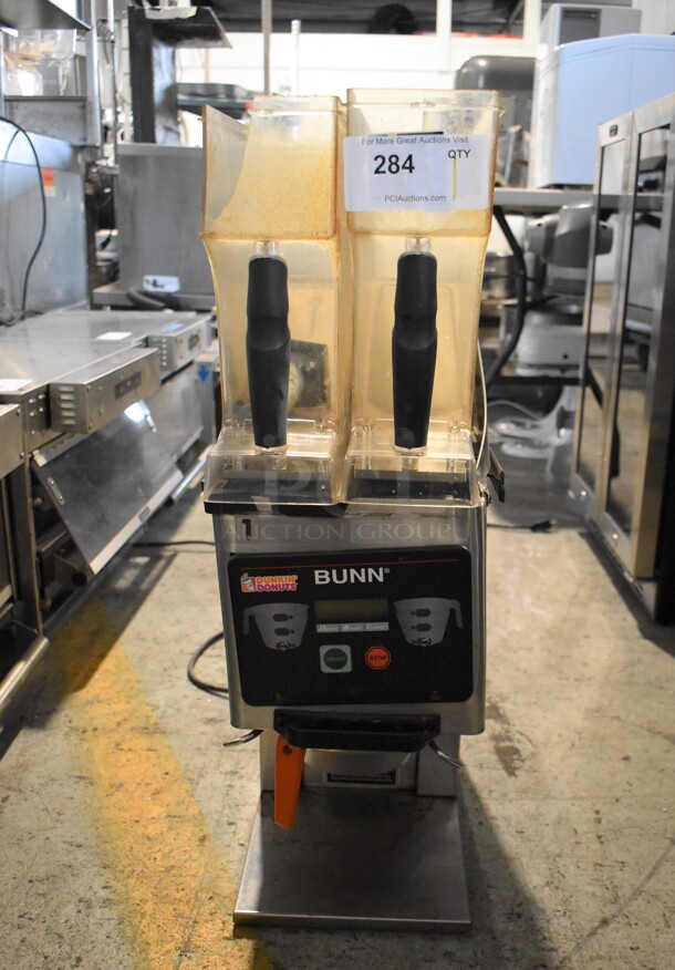 2010 Bunn MHG Stainless Steel Commercial Countertop 2 Hopper Coffee Bean Grinder w/ Metal Brew Basket. Missing Lids. See Pictures For Damage. 120 Volts, 1 Phase. Tested and Working!