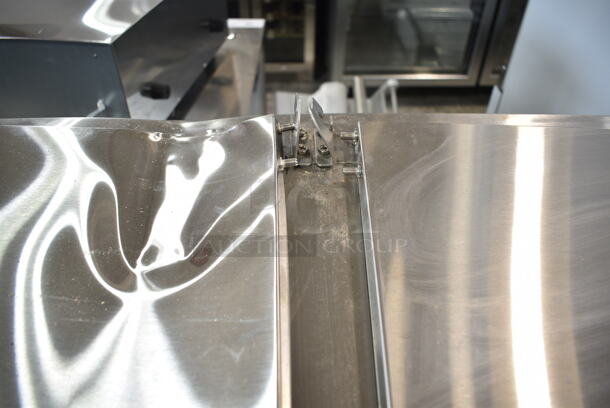 BRAND NEW SCRATCH AND DENT! 2023 Avantco 178APPT91HC Stainless Steel Commercial Pizza Prep Table. Comes w/ Commercial Casters. 115 Volts, 1 Phase. Tested and Does Not Power On - Image 4 of 9