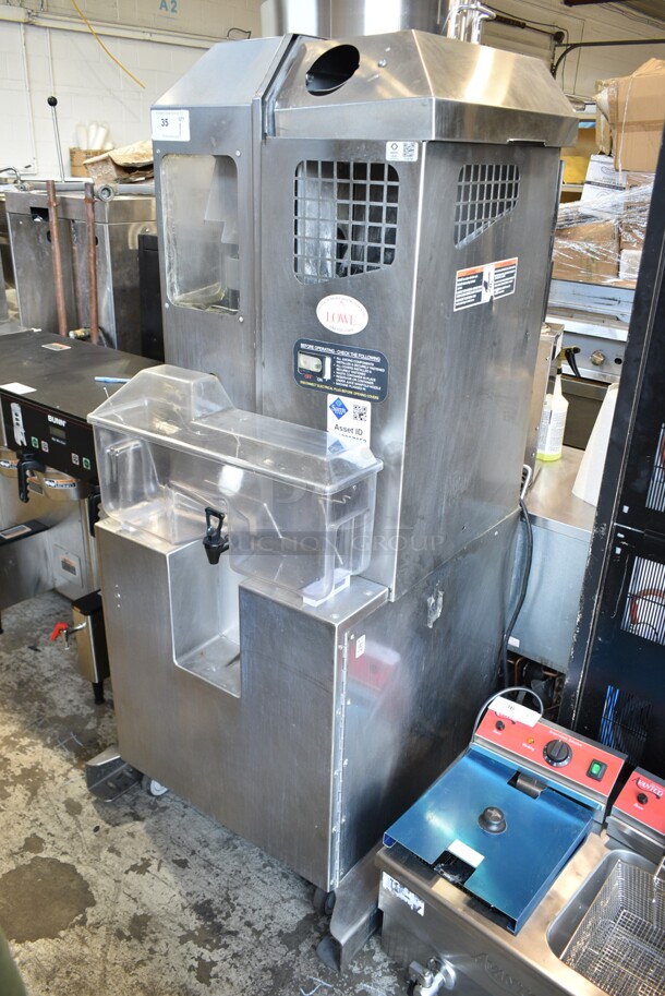 Fresh N Squeeze POS-1 Stainless Steel Commercial Floor Style Automatic Citrus Juicer on Commercial Casters. 120 Volts, 1 Phase. Cannot Test Due To Broken Interlocks - Image 1 of 8