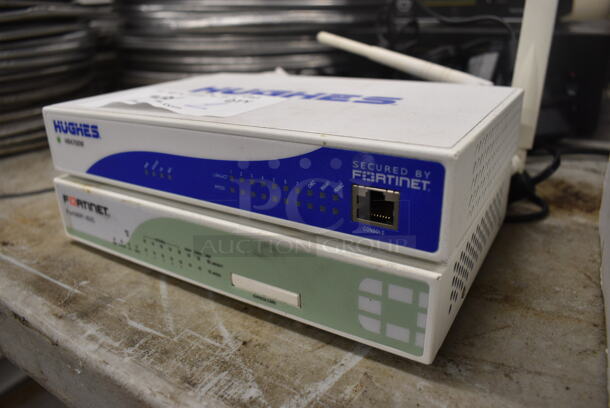 2 Items; Hughes HR4700W and Fortinet FortiWiFi 60C. 8.5x7.5x1.5. 2 Times Your Bid! - Image 2 of 4