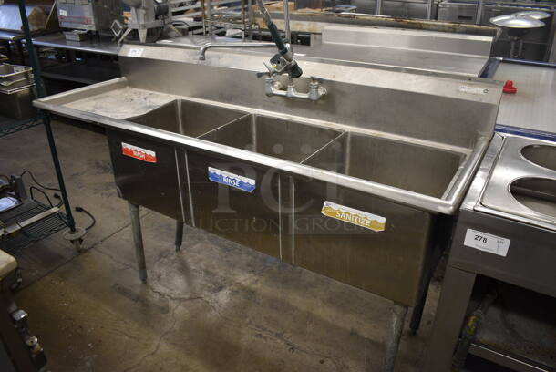 Stainless Steel Commercial 3 Bay Sink w/ Left Side Drainboard, Faucet, Handles and Spray Nozzle Attachment. 75x24x43.5. Bays 18x18x14. Drainboard 16x20x1
