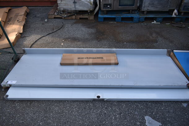 BRAND NEW SCRATCH AND DENT! Regency 600TB3096G 30" x 96" 18-Gauge 304 Stainless Steel Commercial Work Table with 4" Backsplash and Galvanized Undershelf - Image 2 of 6