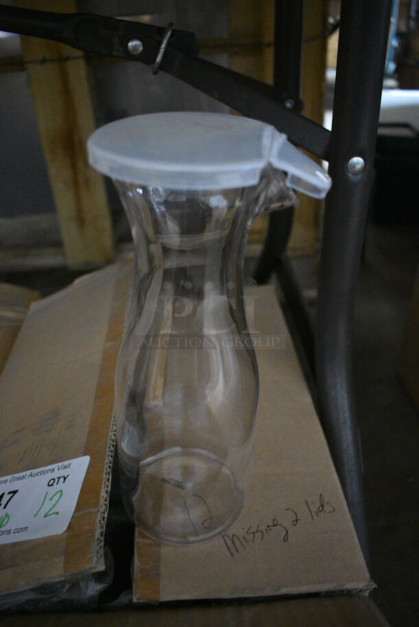 ALL ONE MONEY! Lot of 12 BRAND NEW IN BOX! Clear Poly Decanters w/ 10 Lids. 4x4x11 - Image 1 of 3