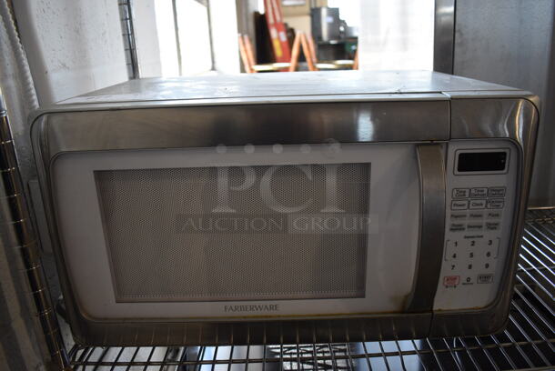 Farberware Model FMO11AHPLU Metal Countertop Microwave Oven w/ Plate. 120 Volts, 1 Phase. 20x15x12