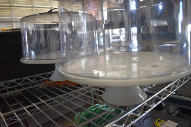 2 White Ceramic Cake Stands w/ Clear Poly Dome Covers. 12.5x12.5x4, 11x11x8. 2 Times Your Bid! - Image 2 of 3