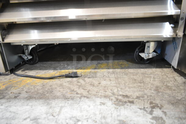 BRAND NEW SCRATCH AND DENT! 2023 Avantco 178A23RHC Stainless Steel Commercial Single Door Reach In Cooler w/ Poly Coated Racks on Commercial Casters. 115 Volts, 1 Phase. Tested and Working! - Image 4 of 8