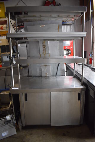 Stainless Steel Commercial Table w/ 3 Over Shelves, 3 Warming Strips, 2 Doors and Under Shelf. 48x30x82