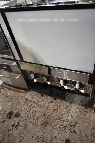 FBD 554 Stainless Steel Commercial Countertop 4 Flavor Slushie Machine. 208-230 Volts, 1 Phase.