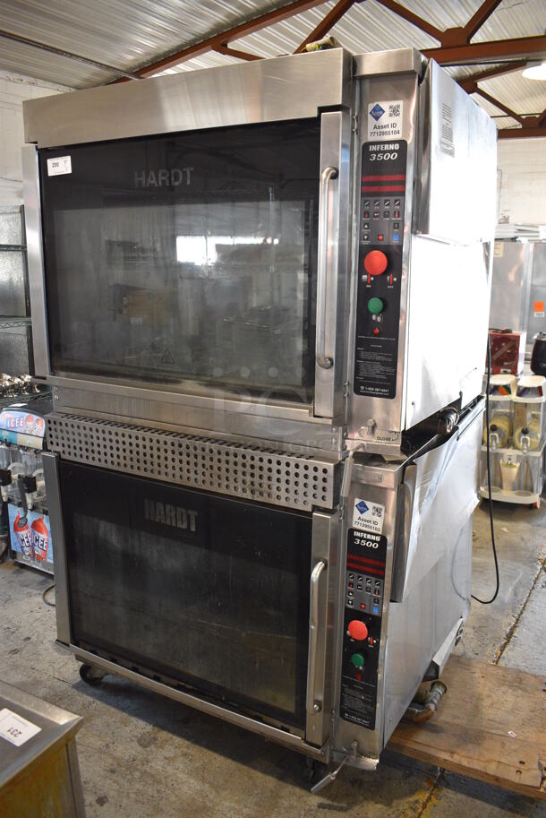 2 Hardt Model Inferno 3500 Stainless Steel Commercial Natural Gas Powered Rotisserie Ovens on Commercial Casters. Each Oven Has a 40 Bird Capacity. 50x50x84. 2 Times Your Bid!