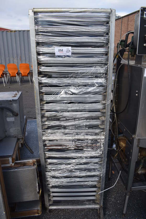 Metal Commercial Pan Transport Rack w/ 71 Metal Full Size Baking Pans on Commercial Casters. 21.5x27.5x69.5 - Image 1 of 3