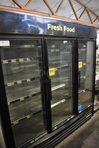 True GDM-72 Commercial Reach In Floor Style Triple Swing Glass Door Merchandiser Cooler In Black With Polycoated Racks. 115V/ 1 Phase Tested And Working