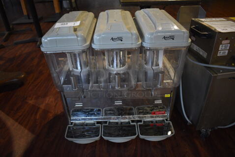 Avantco 177RDM33 Stainless Steel Commercial Countertop 3 Hopper Refrigerated Beverage Machine. 115 Volts, 1 Phase. 24x17x26. Item Was in Working Condition on Last Day of Business. (lounge)
