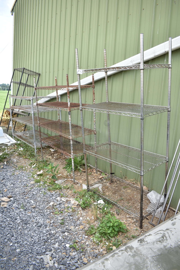 4 Wire Shelving Units; Three Chrome Finish 4 Tier and One Black Finish 5 Tier. 14x18x71, 48x18x72, 60x24x49, 36x18x72. 4 Times Your Bid! BUYER MUST DISMANTLE. PCI CANNOT DISMANTLE FOR SHIPPING. PLEASE CONSIDER FREIGHT CHARGES. - Image 1 of 5