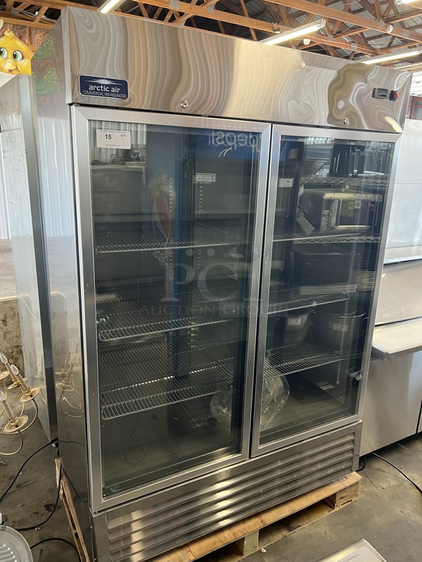 BRAND NEW SCRATCH AND DENT! Arctic Air AGR49 Stainless Steel Commercial 2 Door Reach In Cooler Merchandiser w/ Poly Coated Racks. 115 Volts, 1 Phase. Tested and Working! - Image 1 of 7