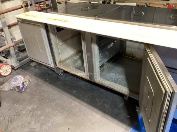 Randell Stainless Steel Dual-Sided Refridgerated Work Island, Multi-Pan Prep Table W/Two -Door and Two Drawers  Refrigerated Storage. Tested And Working. 84 x  46/52 x 58.
 - Image 7 of 11