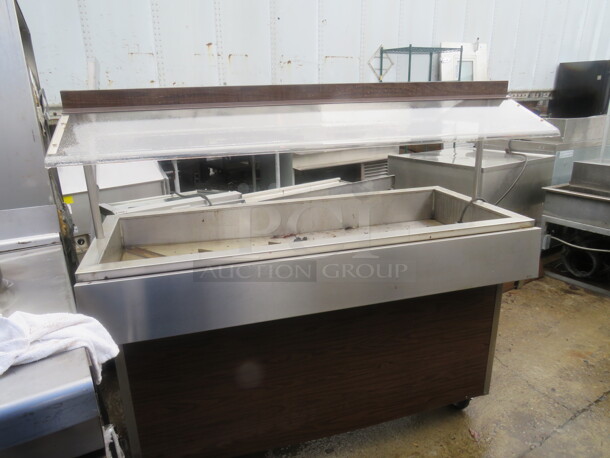 One Stainless Steel Refrigerated Cold Well With Sneeze Guards On Casters. 58X24X54