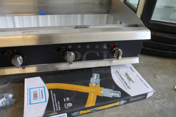 BRAND NEW SCRATCH AND DENT! Cooking Performance Group CPG 351GTUCPG48N Ultra Series Stainless Steel Commercial Countertop Chrome Top Chrome Top Flat Top Griddle w/ Regency Gas Hose Kit and Thermostatic Controls.  - Image 4 of 7