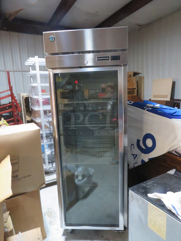 One Hoshizaki 1 Door Glass Display Cooler With 3 Racks On Casters.  Model# R1A-FG. 115 Volt. 27.5X34X80. $5101.00 - Image 1 of 3