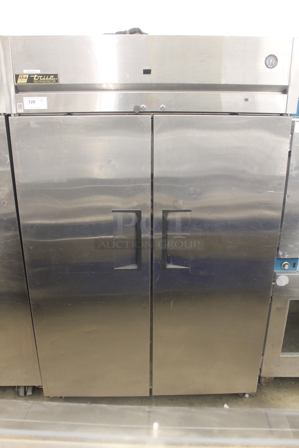 2014 True TG2R-2S ENERGY STAR Stainless Steel Commercial Two Door Reach In Cooler w/ Poly Coated Racks on Commercial Casters. 115 Volts, 1 Phase. Tested and Working! - Image 1 of 7