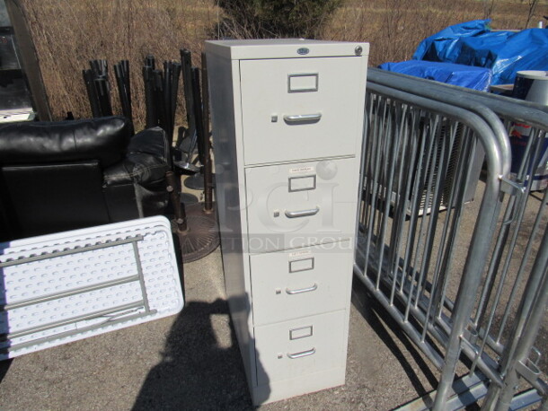 One 4 Drawer Metal File Cabinet. 15X26.5X51