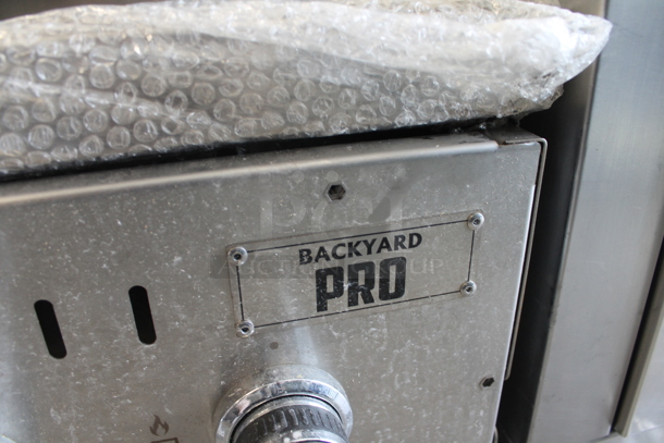 BRAND NEW SCRATCH AND DENT! 2022 Backyard Pro LPG60RD 60" Stainless Steel Liquid Propane Outdoor Grill With 2 Roll Dome Lids. Stock Picture Used as Gallery Picture. - Image 11 of 12