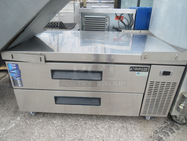 One Stainless Steel 2 Drawer Dukers Refrigerated Chef Base On Casters. Model# DCB48-D2. 115 Volt. 48.5X32X25. - Image 1 of 2