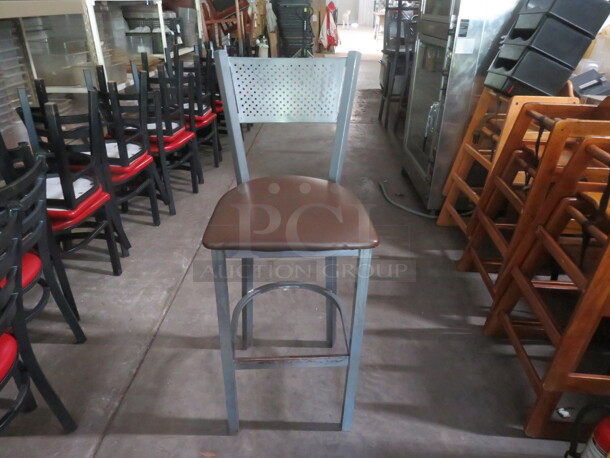 Gray Metal Bar Height Chair With A Foot Rest, And A Brown Cushioned Seat. 2XBID - Image 1 of 3