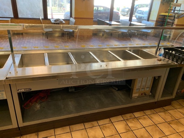 One Duke 6 Well Refrigerated Prep Table With Glass Sneeze Guard And Under Shelf. 86X34X37.5. 115 Volt. Model# SUBFC 206 LF. - Image 1 of 1