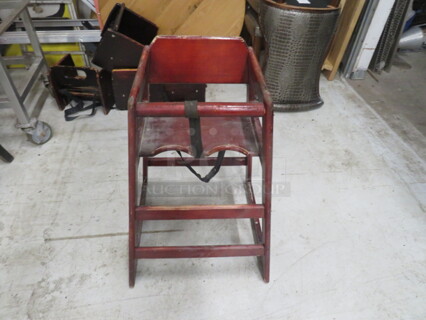 One Wooden High Chair.