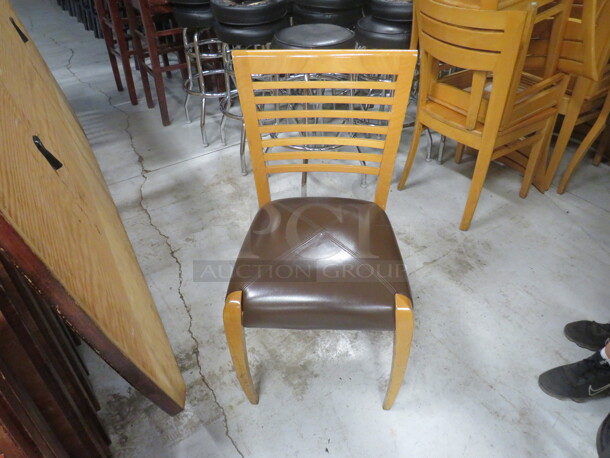 Wooden Chair In A Natural Finish With A Brown Cushioned Seat. 4XBID. - Image 1 of 1