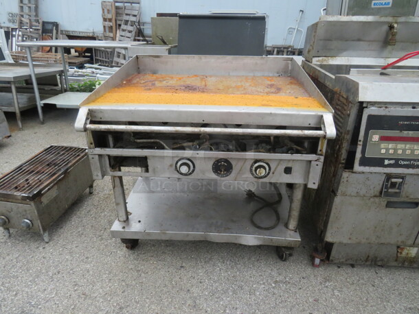 One Vulcan Natural Gas Griddle On A Table With Under Shelf On Casters. #936A. 36X36X37 - Image 1 of 1