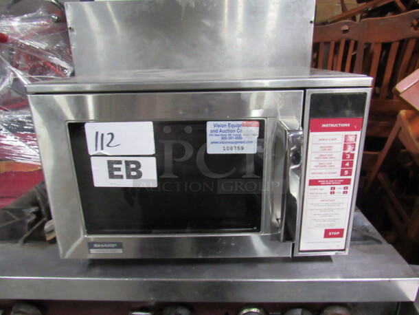 One Stainless Sharp Microwave. Model# 1800W/R-24GT. 20X18.5X13