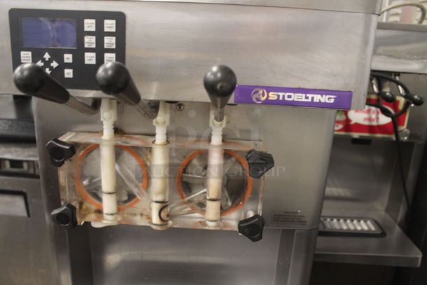 2011 Stoelting F231-18I2-OT2 Stainless Steel Commercial Floor Style Water Cooled 2 Flavor w/ Twist Soft Serve Ice Cream Machine on Commercial Casters. 208-240 Volts, 1 Phase.  - Image 4 of 6