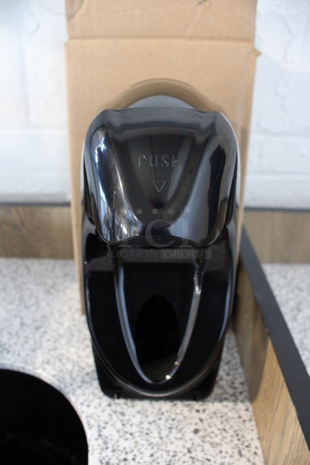 4 BRAND NEW IN BOX! Black Poly Wall Mount Soap Dispensers. 5x7x11. 4 Times Your Bid!