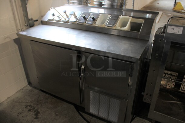 Model F5510SS Stainless Steel Commercial Prep Station w/ 2 Lower Refrigerated Doors, 9 Drop In Bins and 7 Lids on Commercial Casters. 115 Volts, 1 Phase. 54x36x43. Tested and Working!