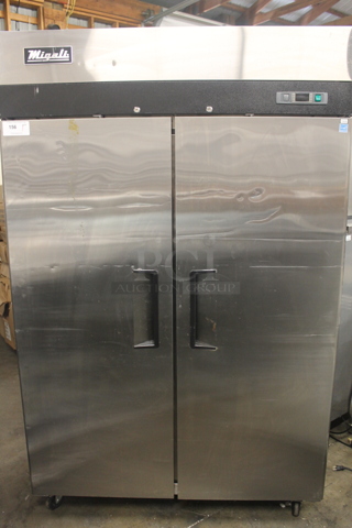 Migali C-2F-HC Stainless Steel Commercial 2 Door Reach In Freezer w/ Poly Coated Racks on Commercial Casters. 115 Volts, 1 Phase. Tested and Working!