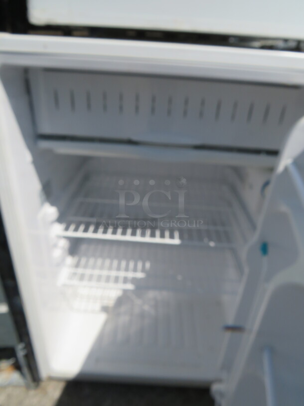 One WORKING GE 1 Door Under COunter Refrigerator With 2 Racks. Model# GMR06AAPWW. 115 Volt. 24X24X34 - Image 2 of 2