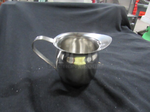 One NEW Update 8oz Stainless Steel Bell Creamer. - Image 1 of 1