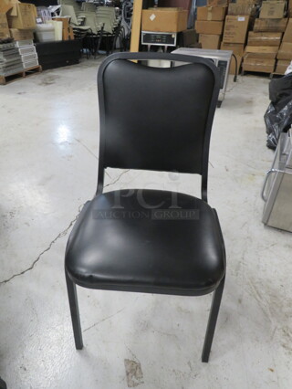 Black Metal Stack Chair With Cushioned Seat And Back. 4XBID