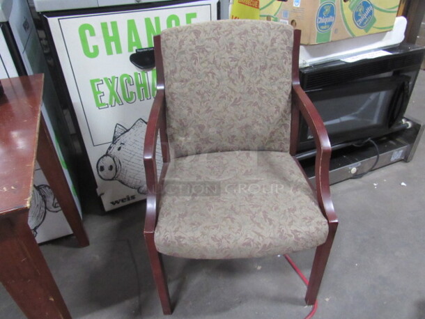 One Wooden Chair With Cushioned Seat And Back.
